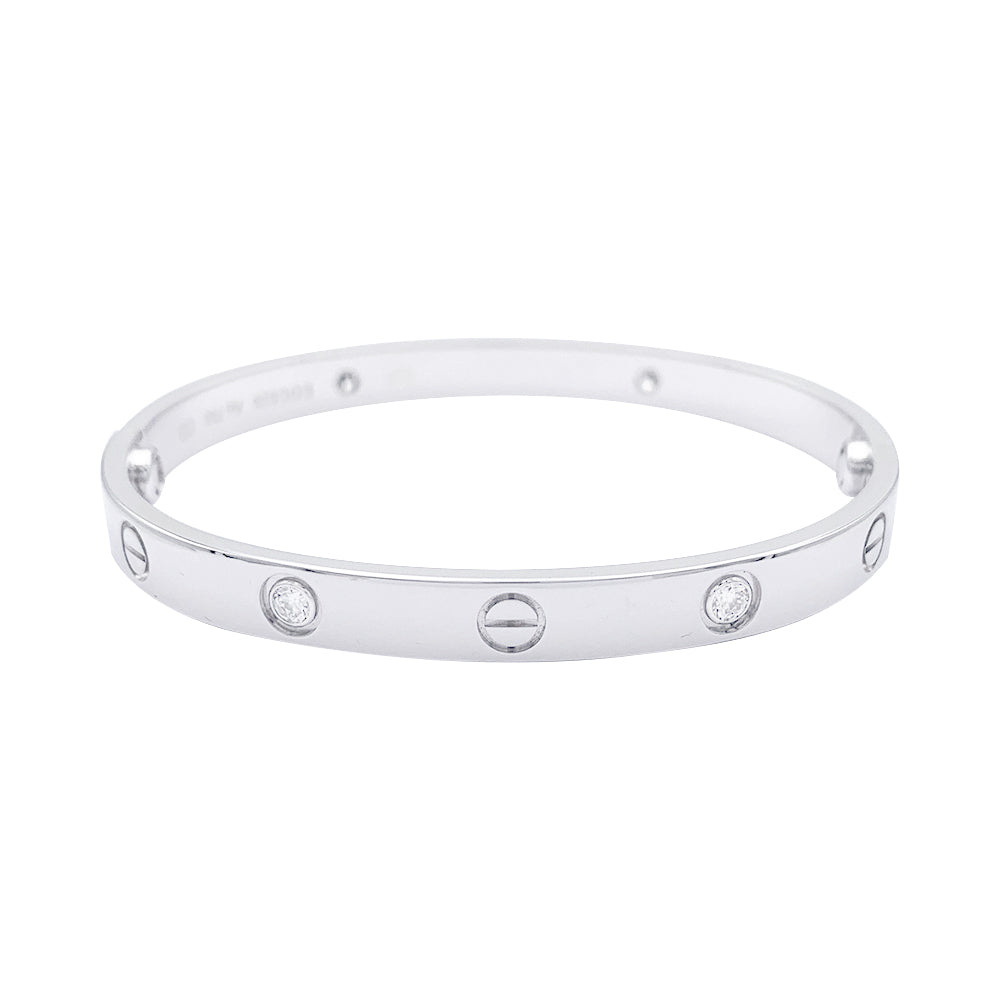 Bracelet Cartier, "Love", or blanc et diamants.