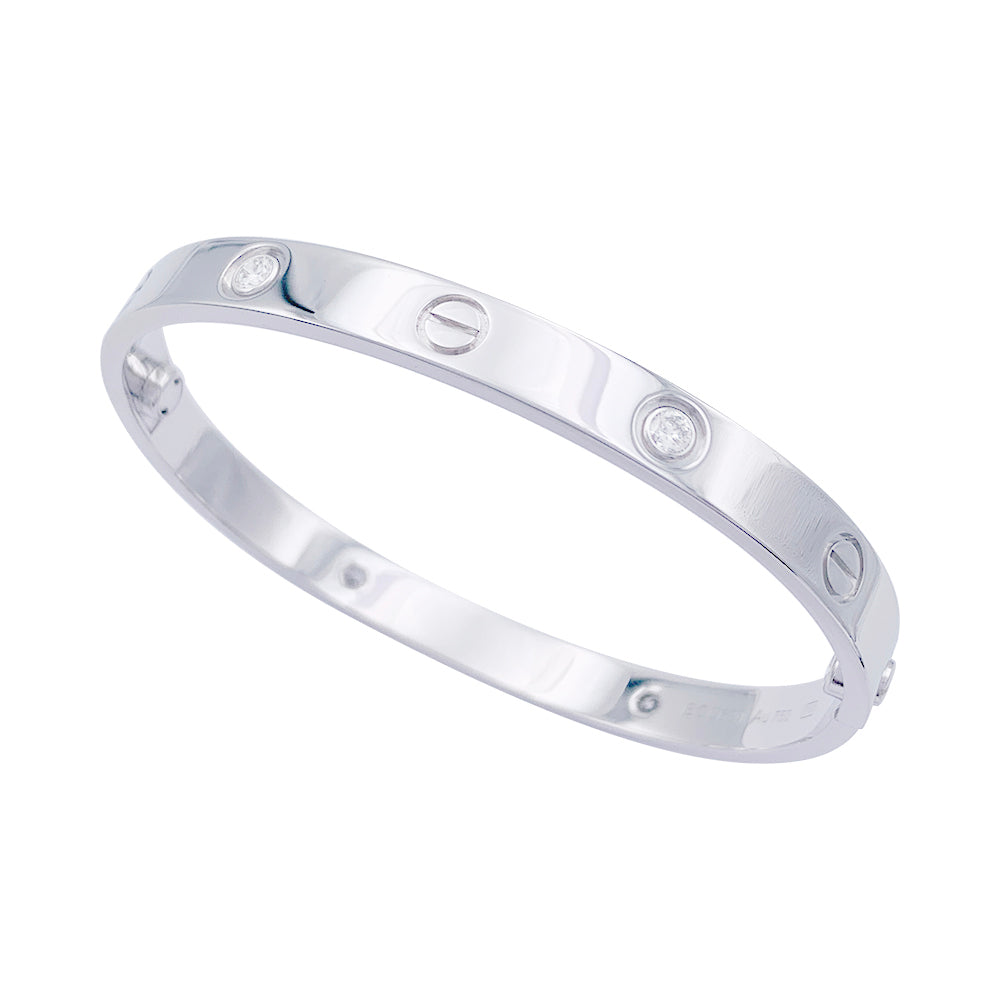 Bracelet Cartier, "Love", or blanc et diamants.