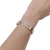 Bracelet Cartier or jaune et acier.