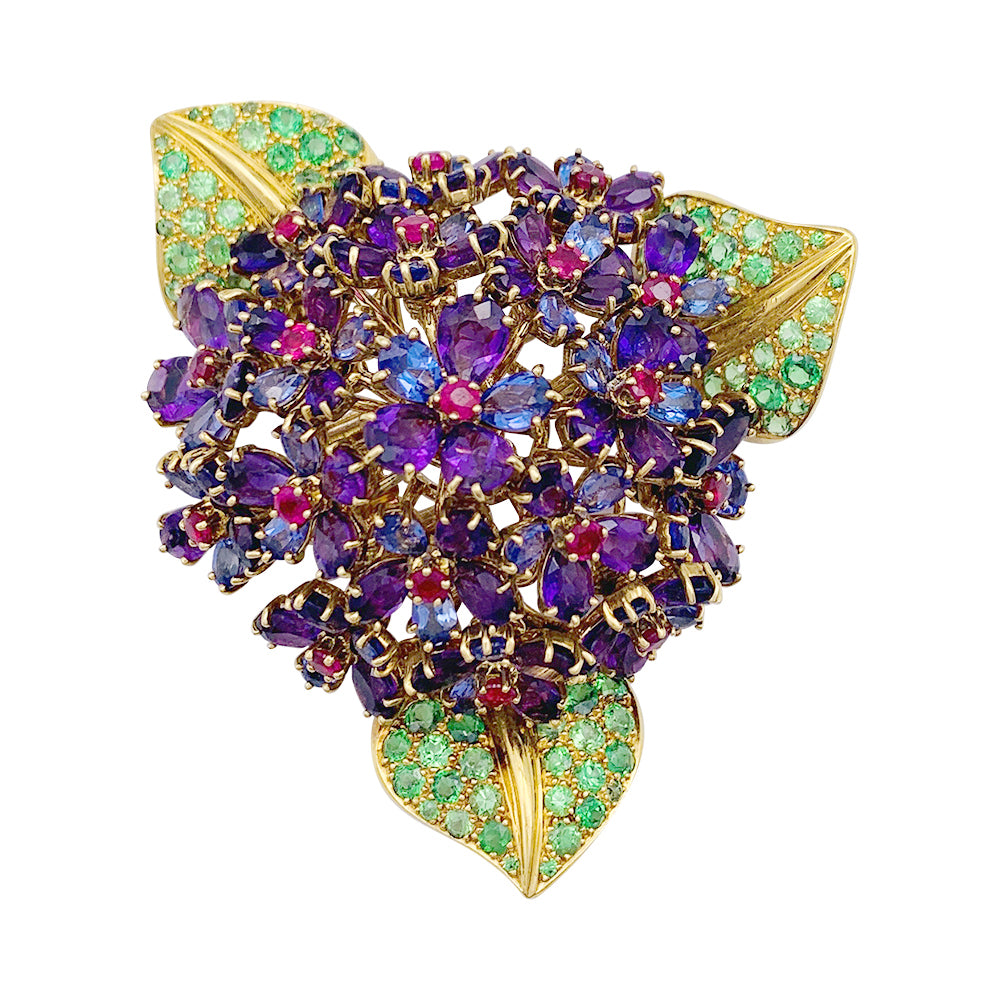 Clip René Boivin,"Bouquet de Violettes", or jaune, gemmes de couleur.