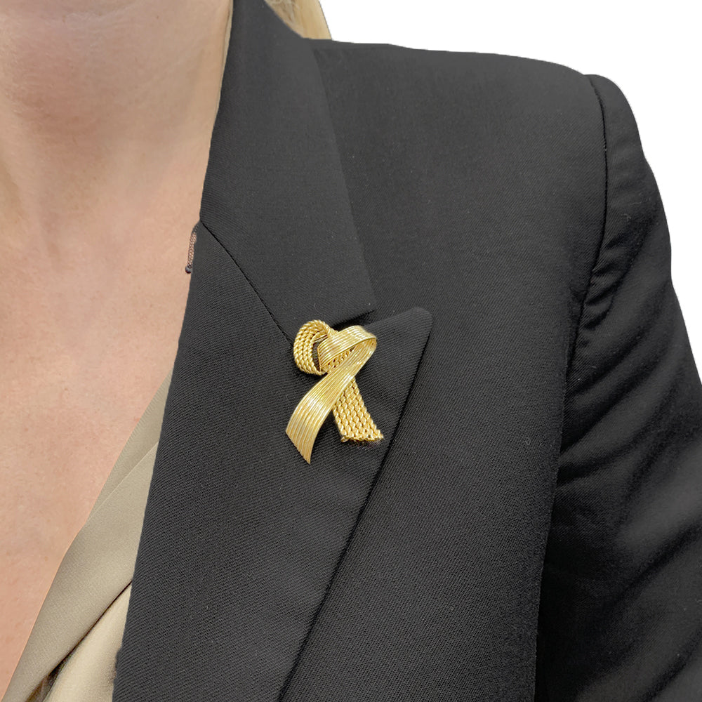 Vintage Mauboussin "Ribbon" brooch, yellow gold.