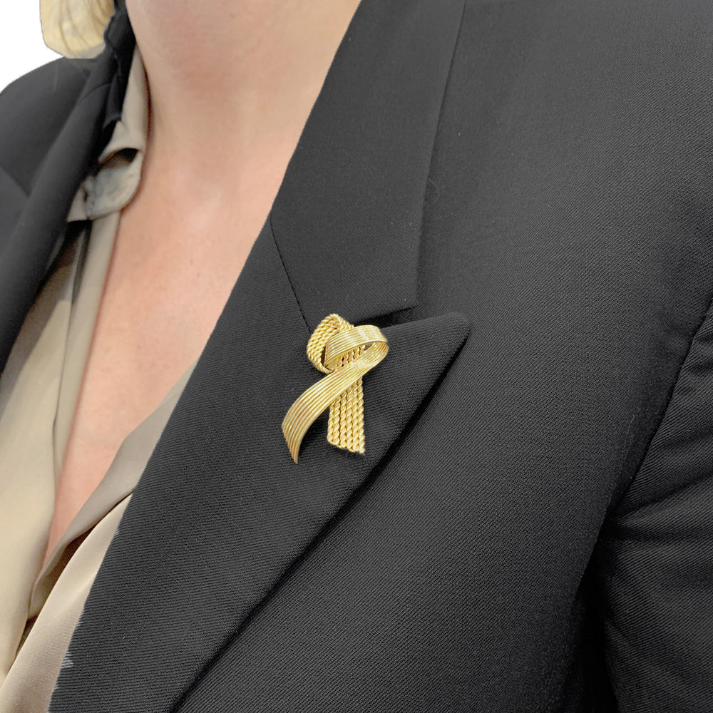 Vintage Mauboussin "Ribbon" brooch, yellow gold.