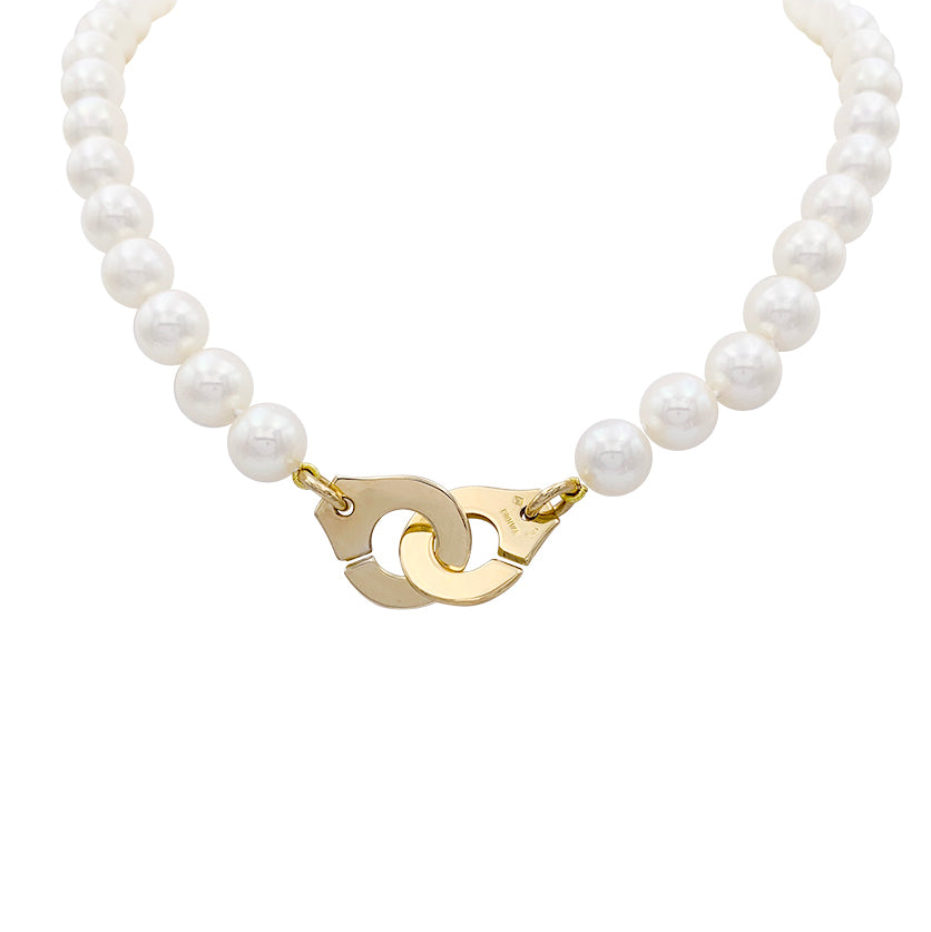 Collier de perles Dinh Van, "Menottes R15", en or jaune.