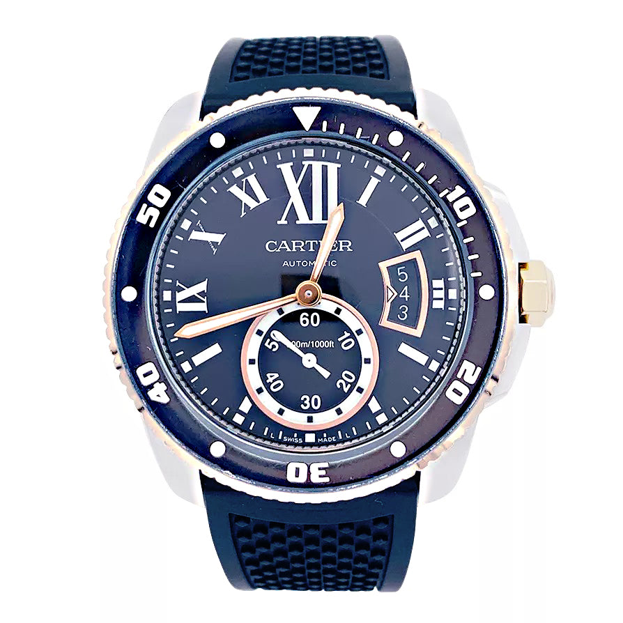 Cartier Calibre watch in gold and steel on a rubber strap.