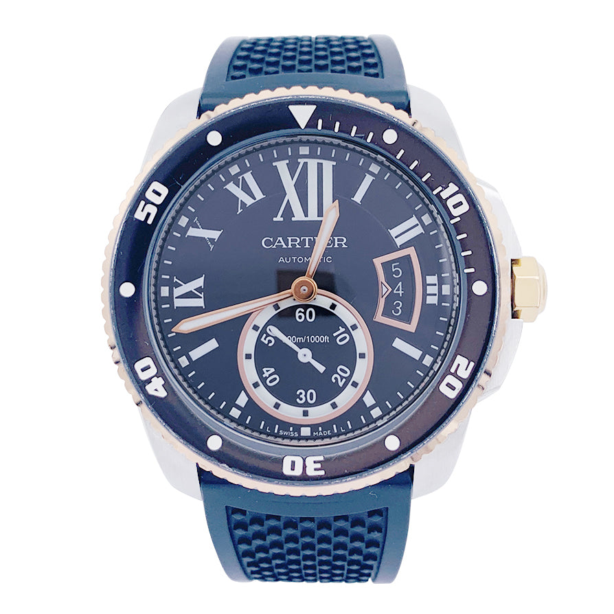 Cartier Calibre watch in gold and steel on a rubber strap.
