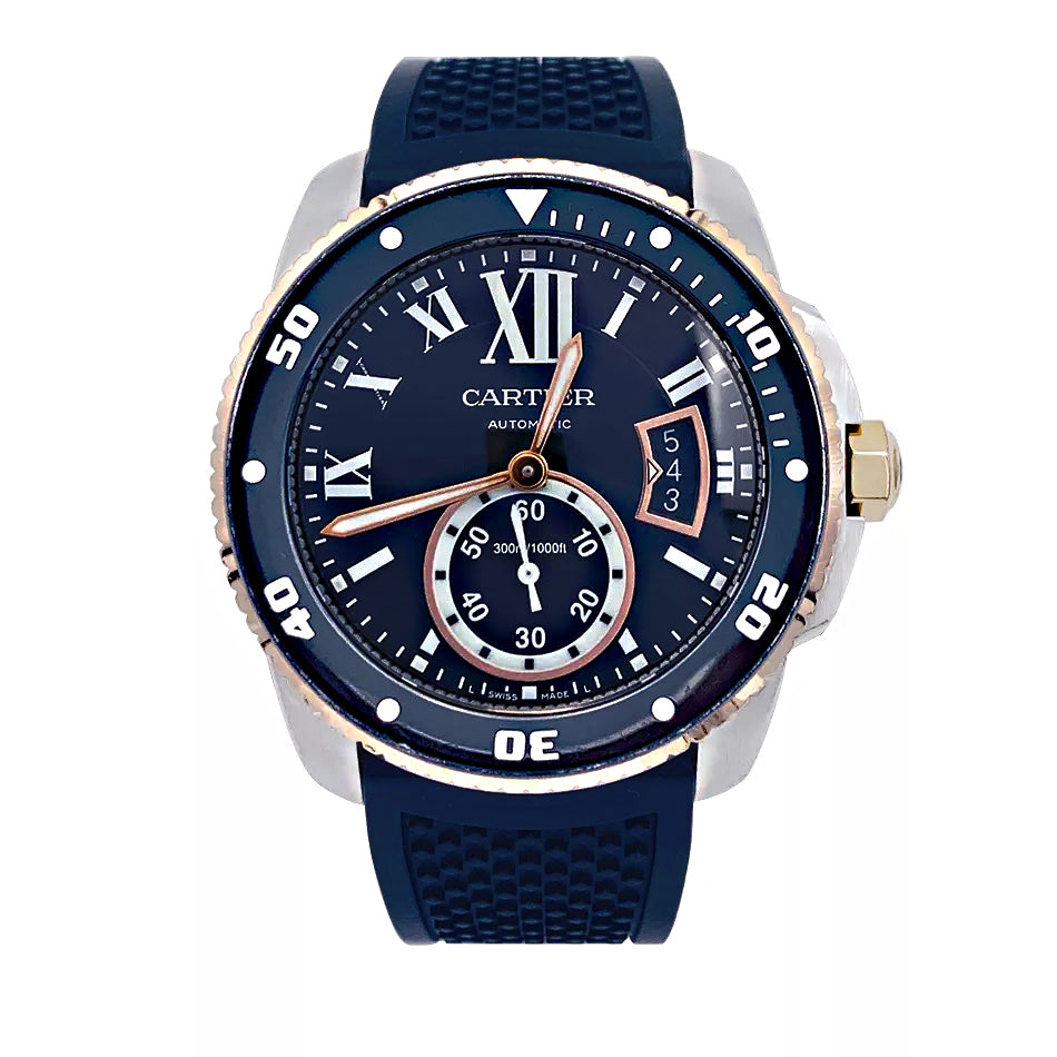 Cartier Calibre watch in gold and steel on a rubber strap.