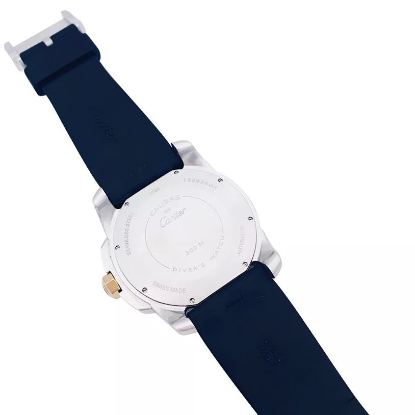 Cartier Calibre watch in gold and steel on a rubber strap.