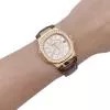 Montre Patek Philippe, "Nautilus", or rose, diamants, cuir.
