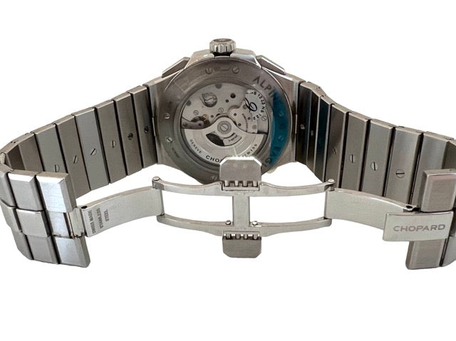 A Chopard Alpine Eagle Chrono steel watch with a blue background