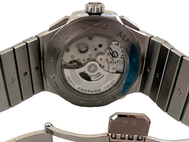 A Chopard Alpine Eagle Chrono steel watch with a blue background