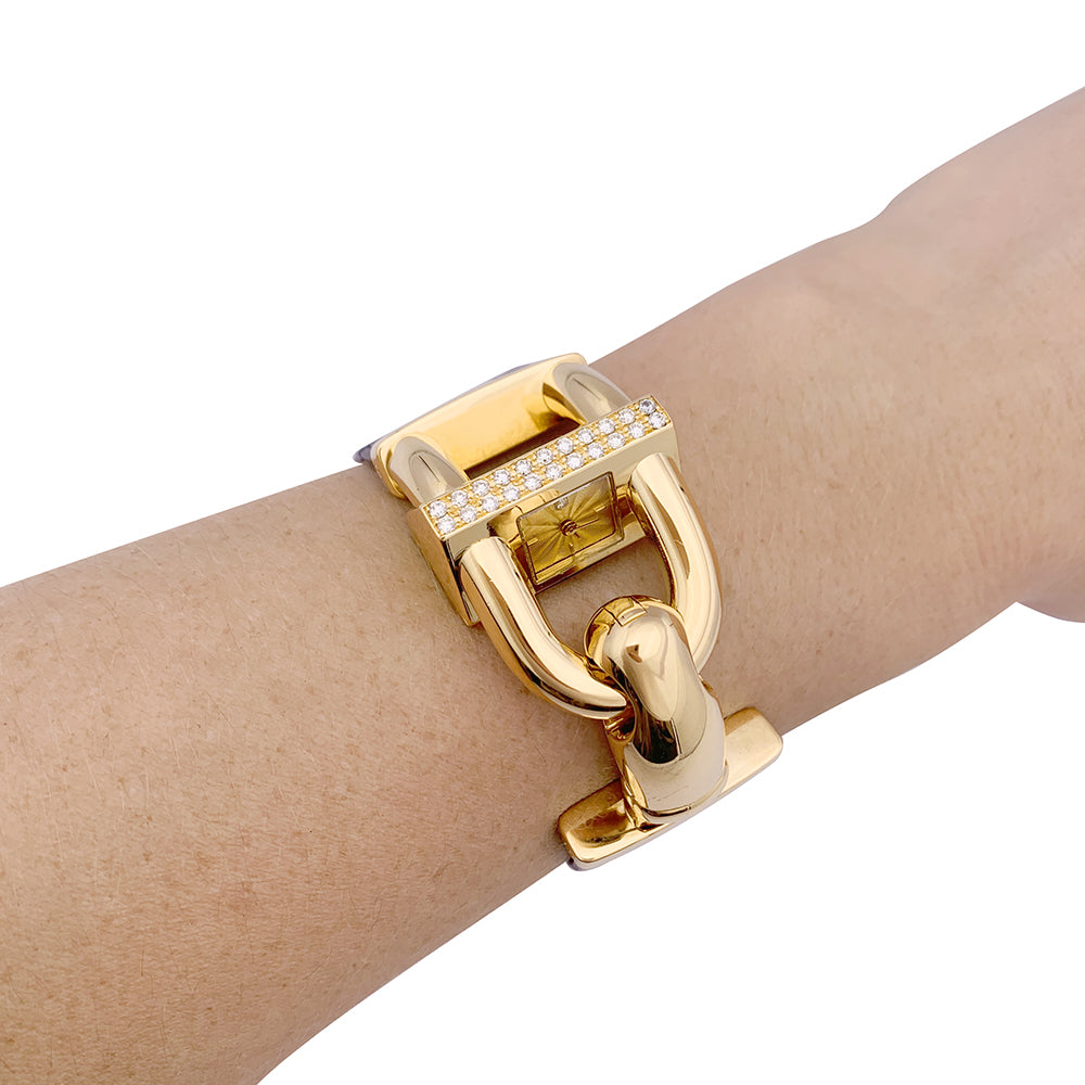 Van Cleef & Arpels “Cadenas” watch in yellow gold, diamonds, leather.