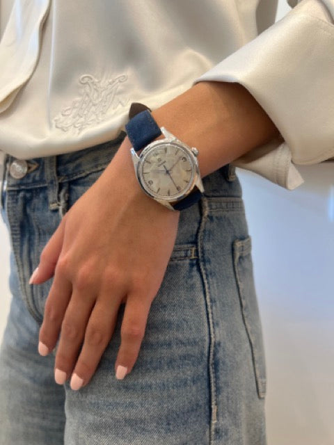 Montre Oméga vintage en acier, bracelet cuir