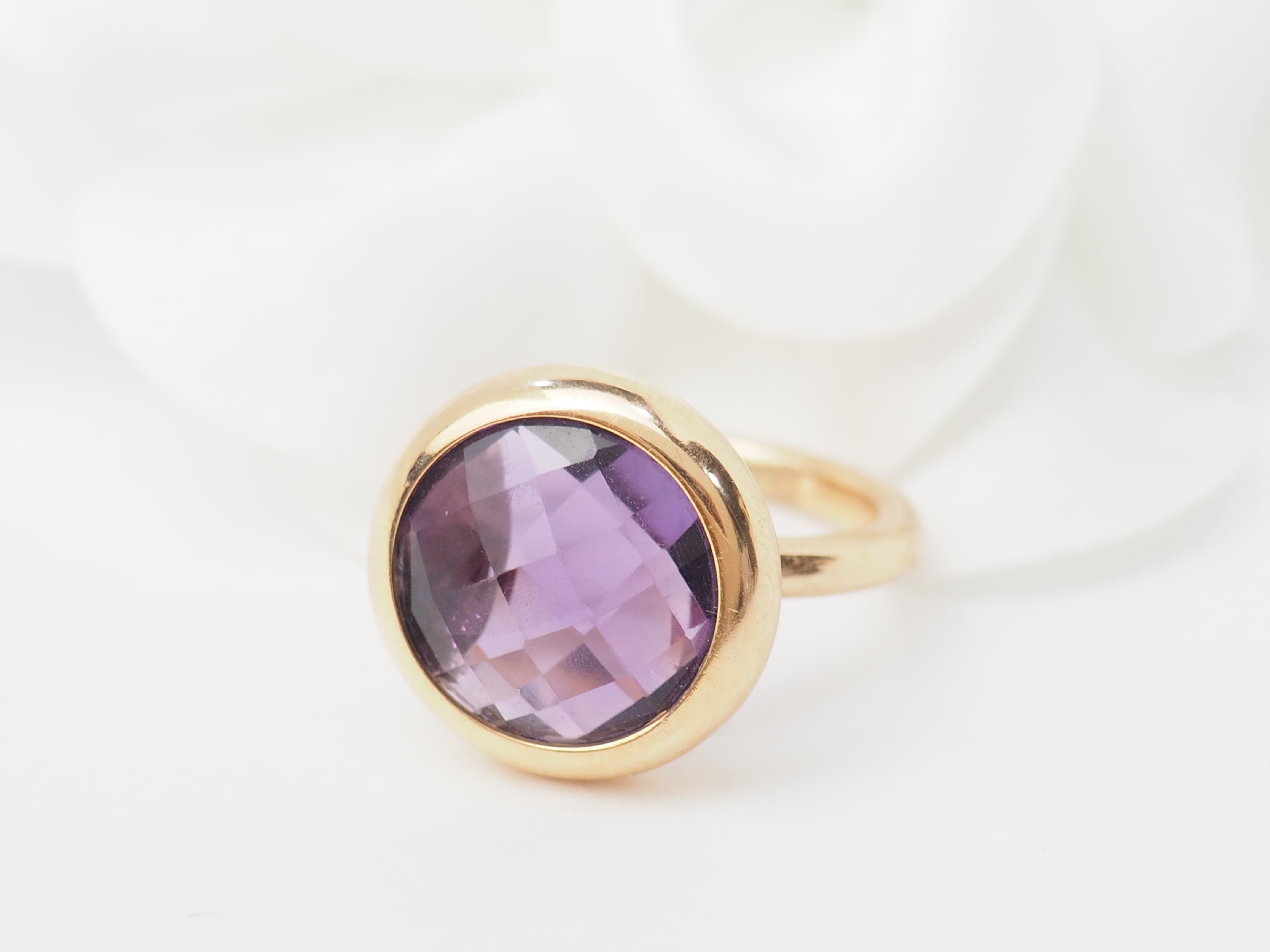 Bague ronde en or rose et améthyste façettée
