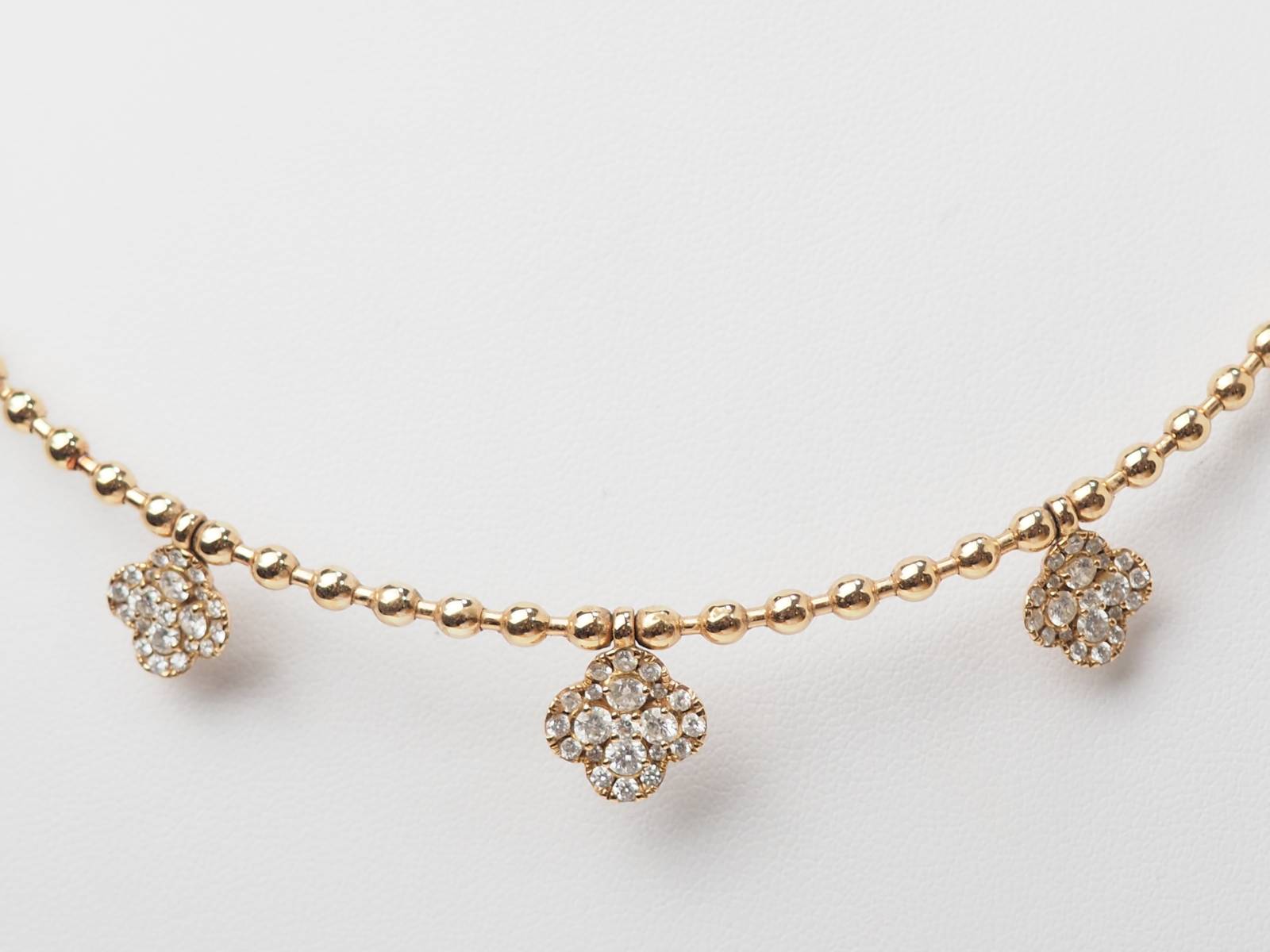 Collier boules rigide et trèfles en or rose et diamants