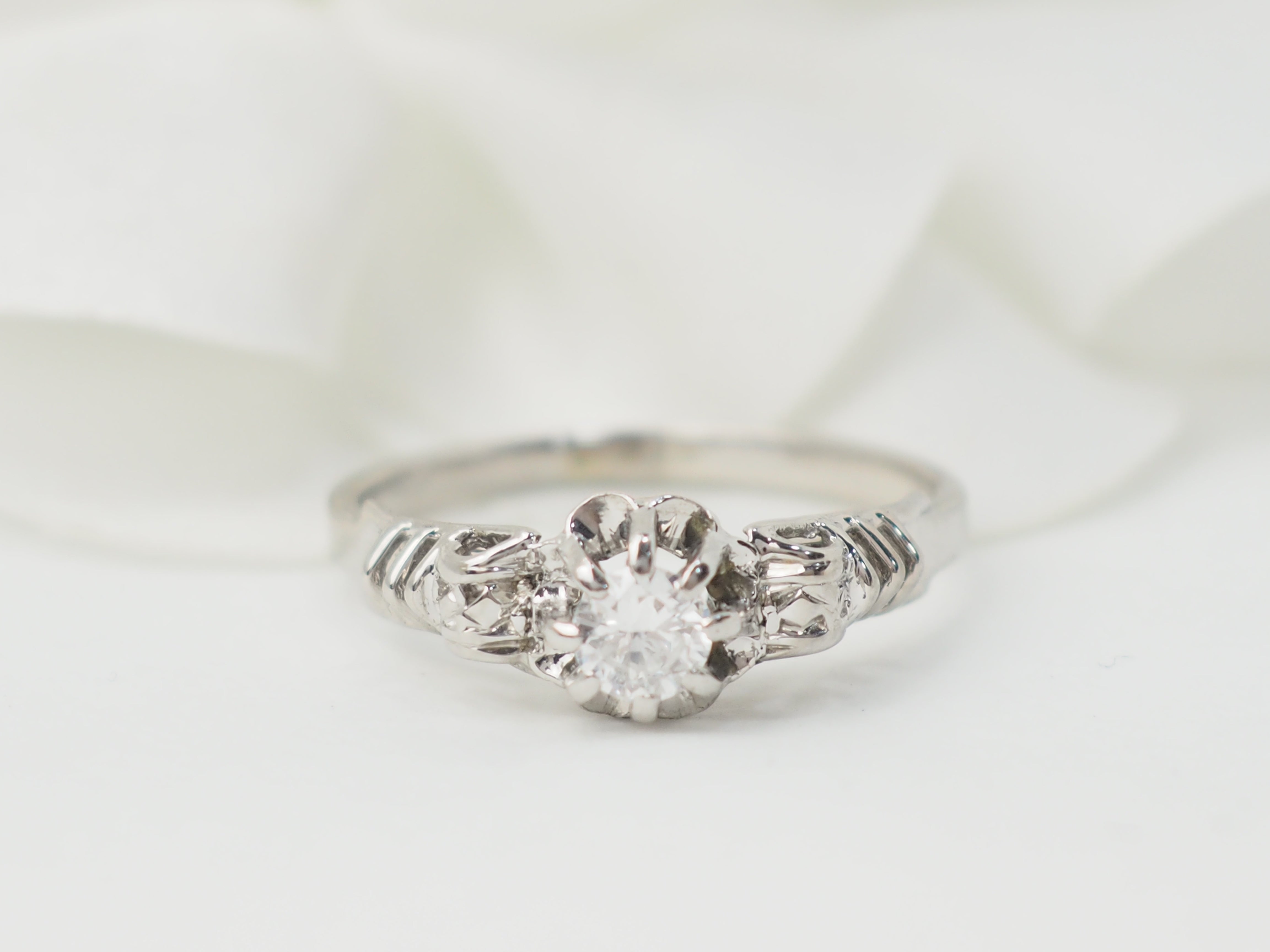 Bague solitaire en or blanc et platine, diamant 0,23ct