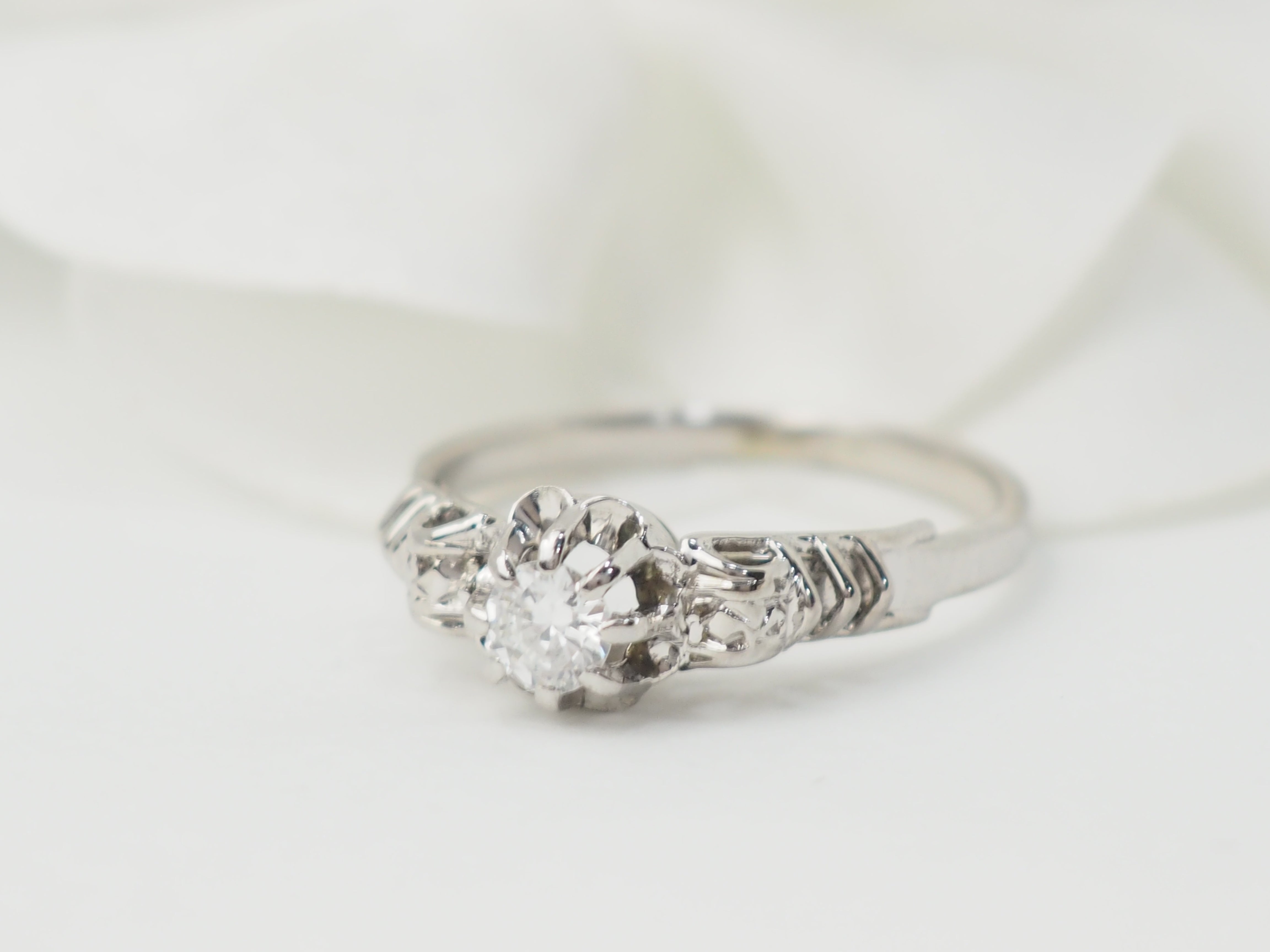 Bague solitaire en or blanc et platine, diamant 0,23ct