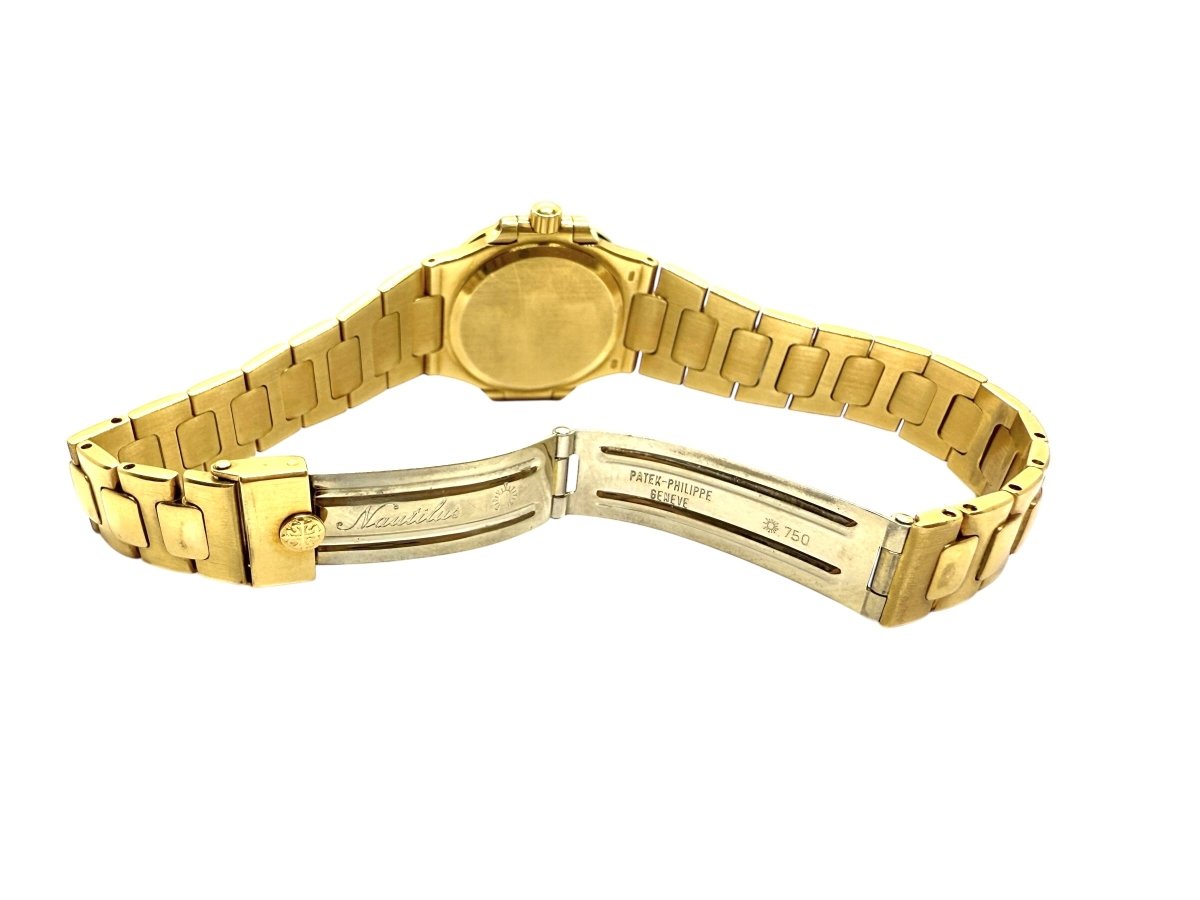 Patek Philippe montre Nautilus vintage or jaune 18K - Maison Eloe