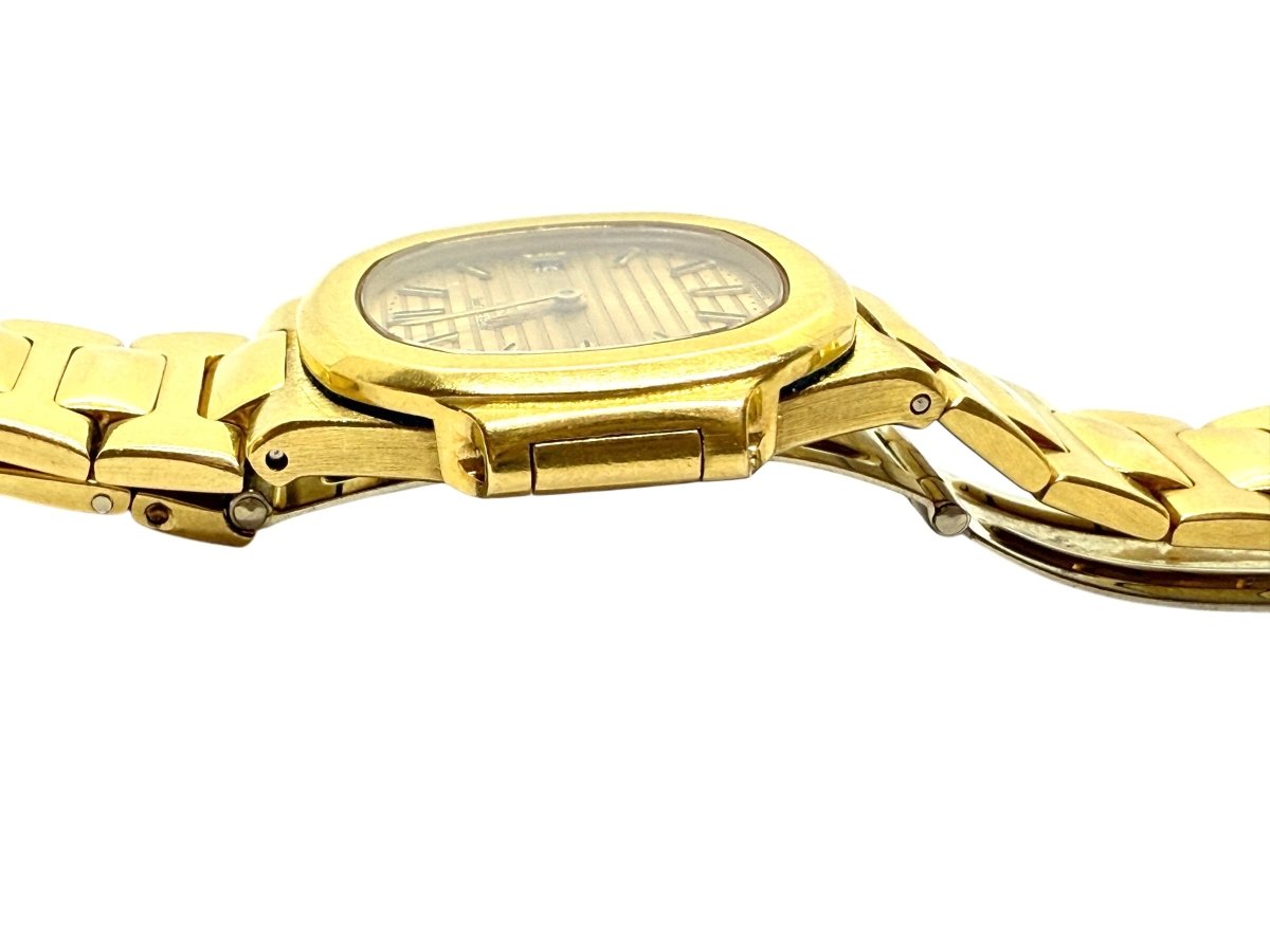 Patek Philippe montre Nautilus vintage or jaune 18K - Maison Eloe