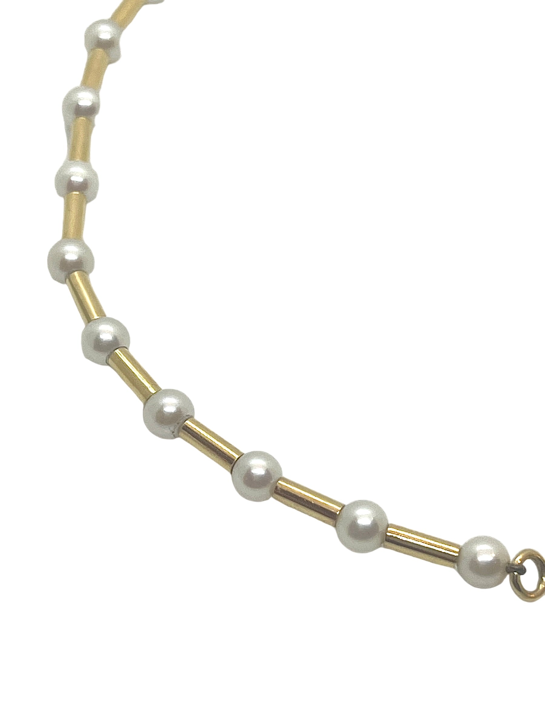 Poiray, "Fuseau" necklace in 18K yellow gold and cultured pearls