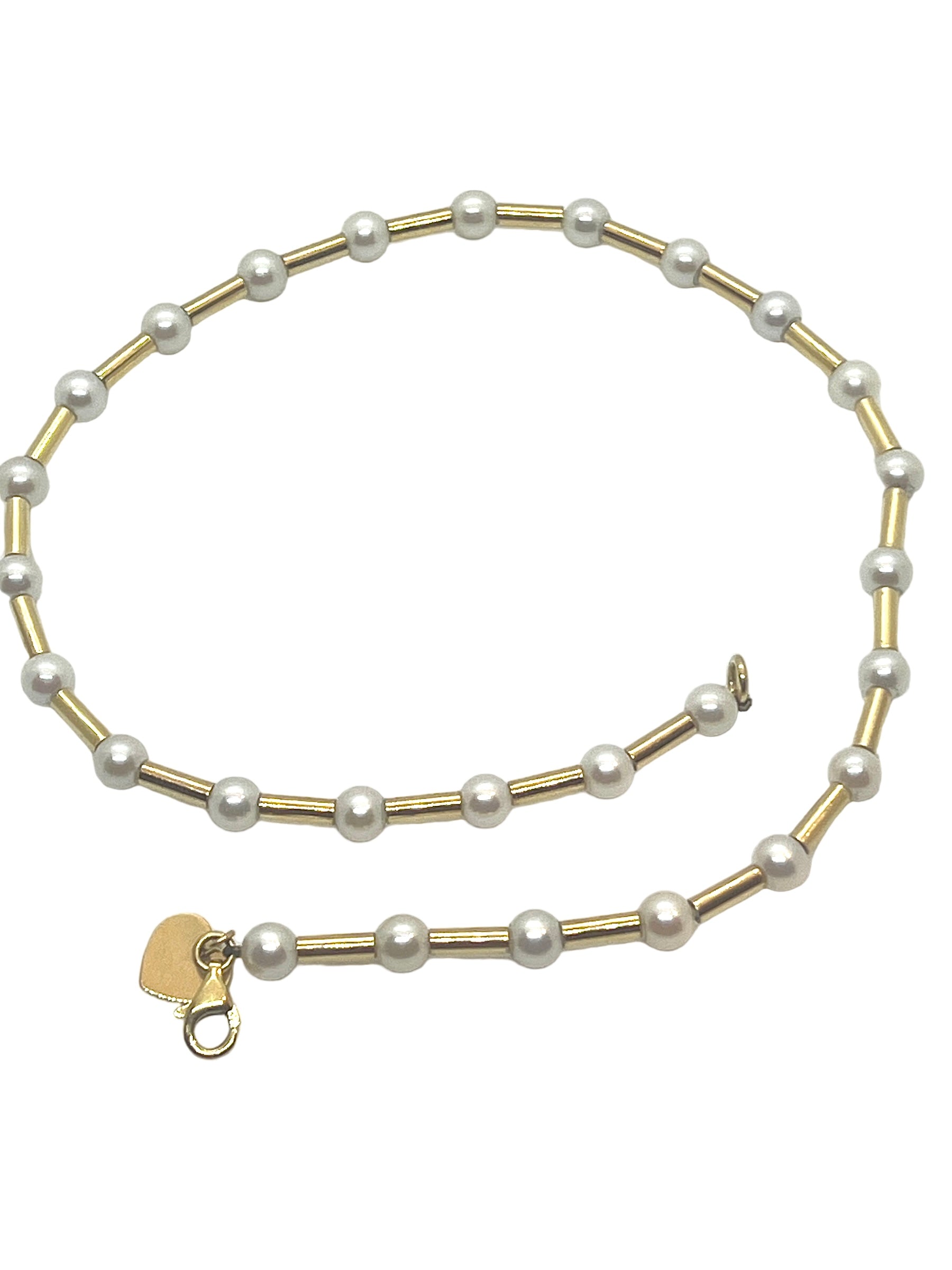 Poiray, "Fuseau" necklace in 18K yellow gold and cultured pearls