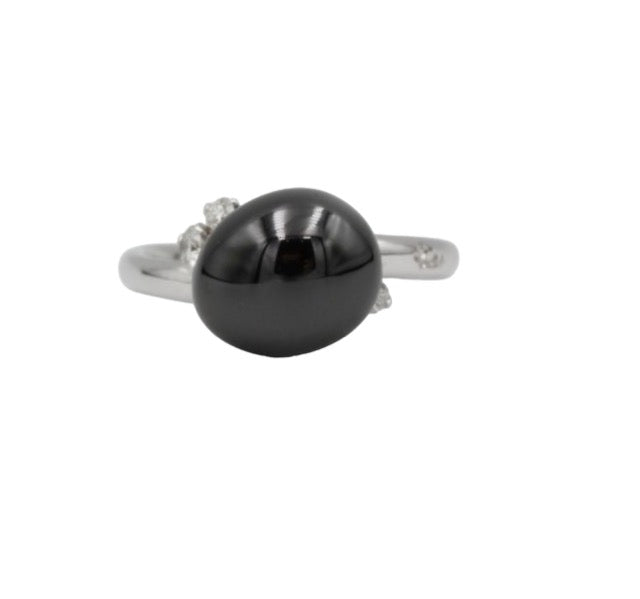 Pomellato, "Capri" ring in 18k white gold set with a black ceramic pearl and 3 diamonds