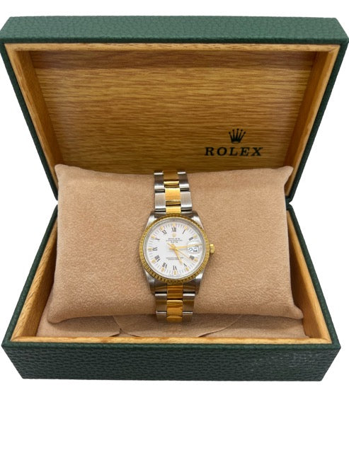 Montre Rolex date or jaune et acier de 1990