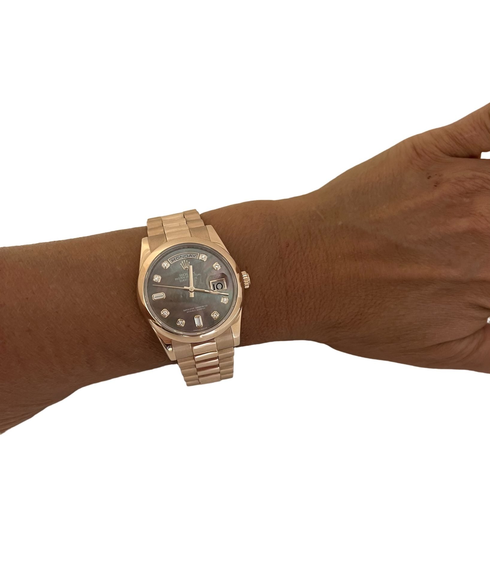 A Rolex Day Date rose gold watch with Tahitian mother-of-pearl dial