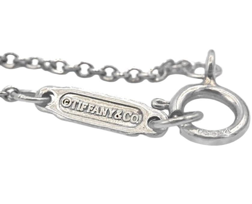 Tiffany & Co., "Victoria Keys" pendant necklace in platinum with diamonds and rubies