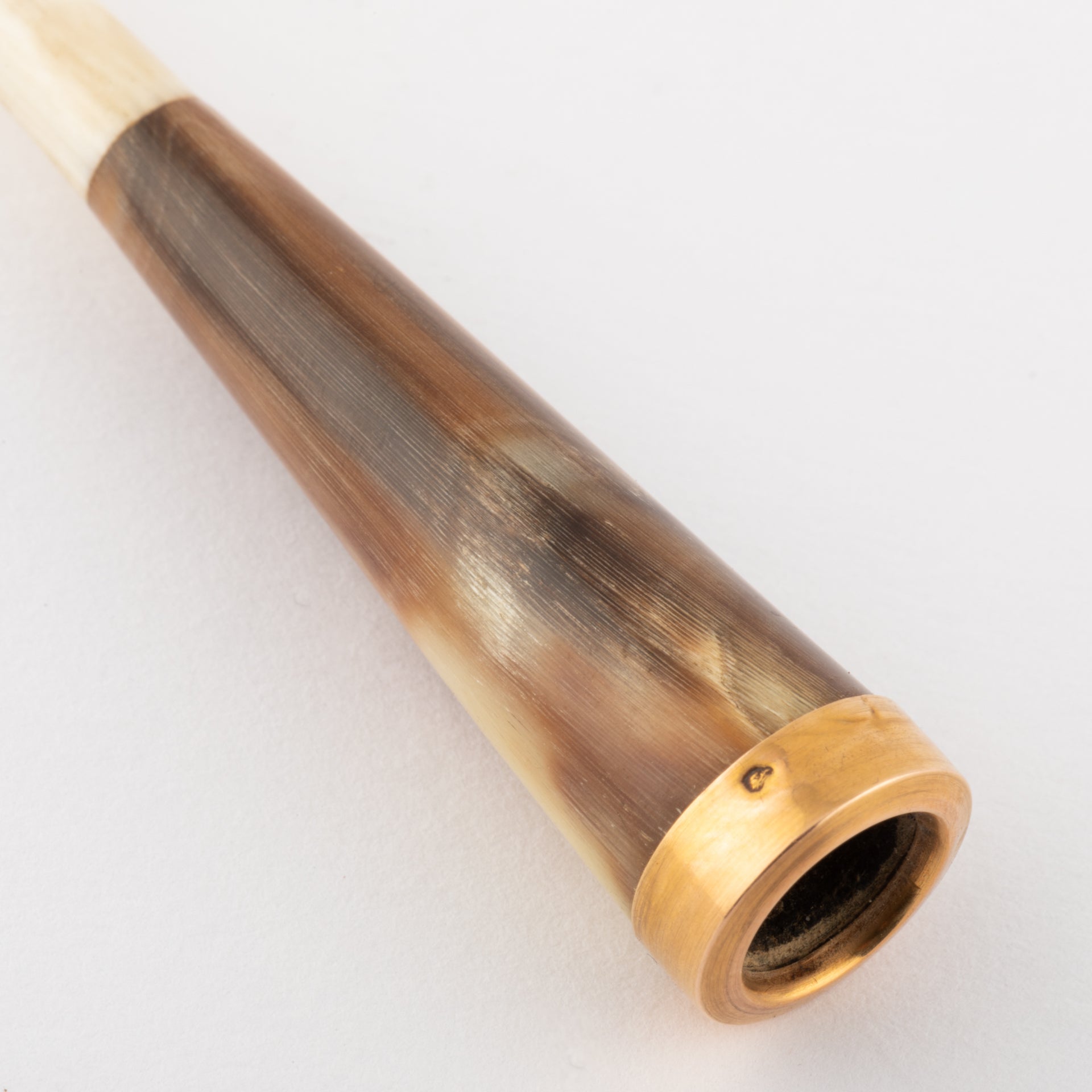Gold and ivory cigarette holder.