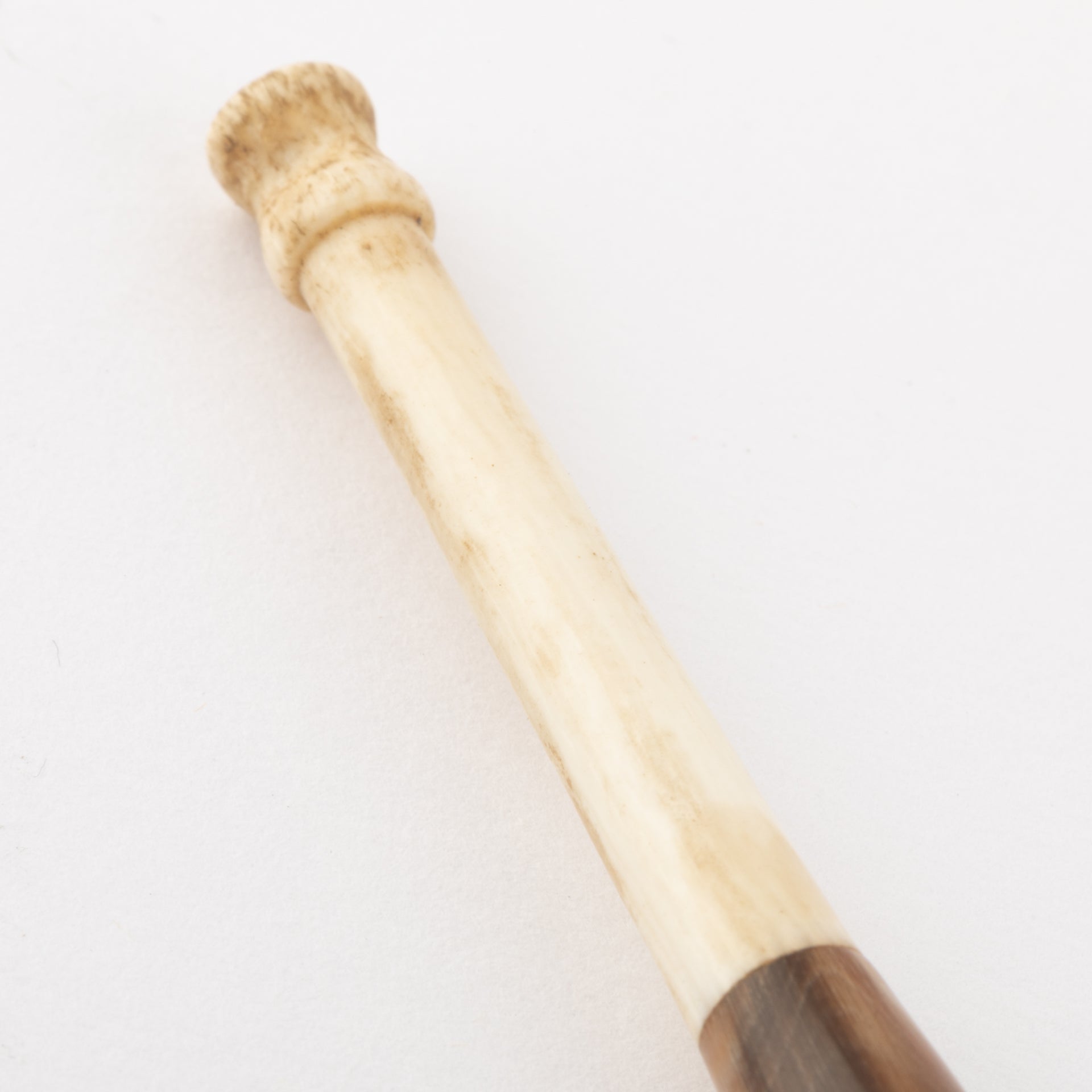Gold and ivory cigarette holder.