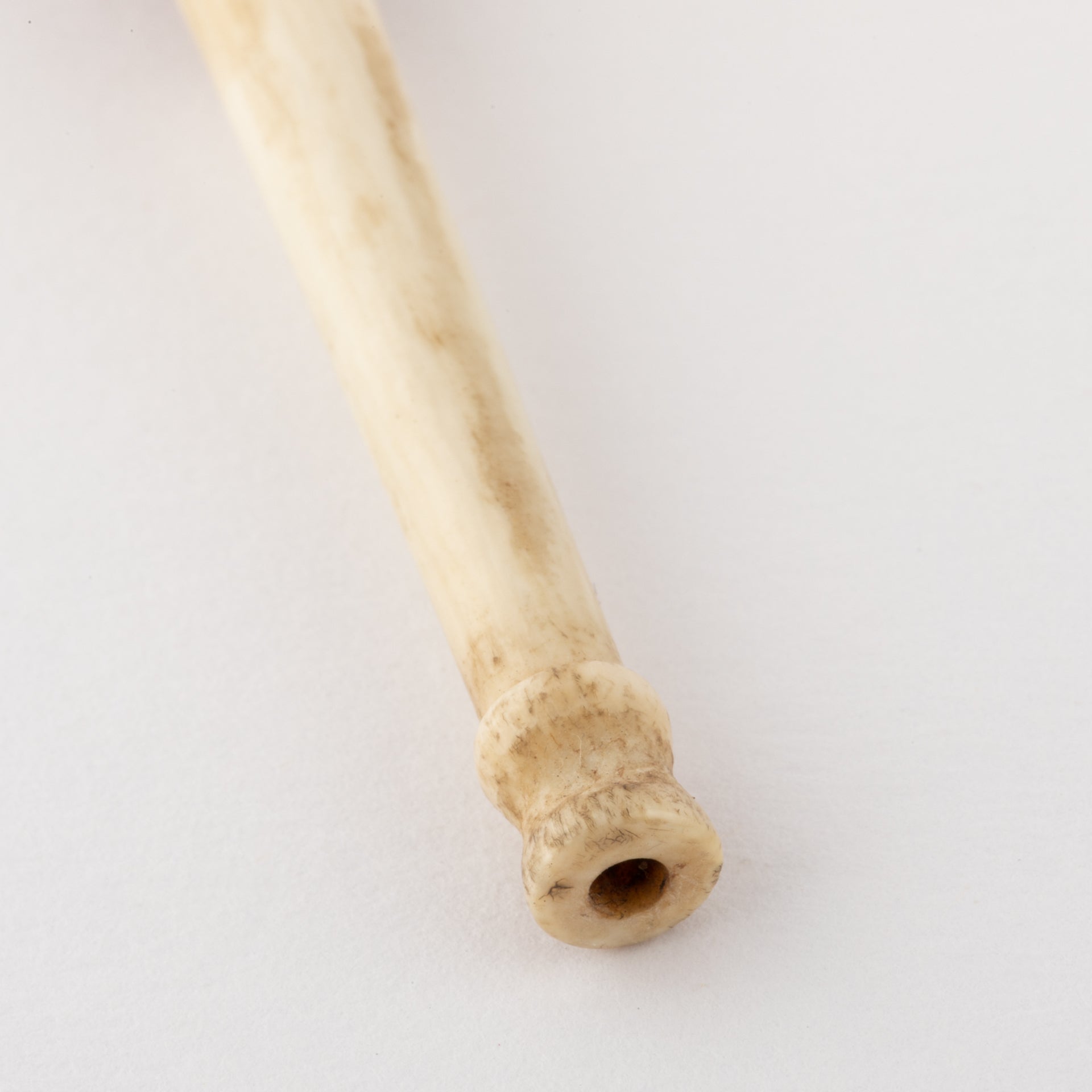 Gold and ivory cigarette holder.