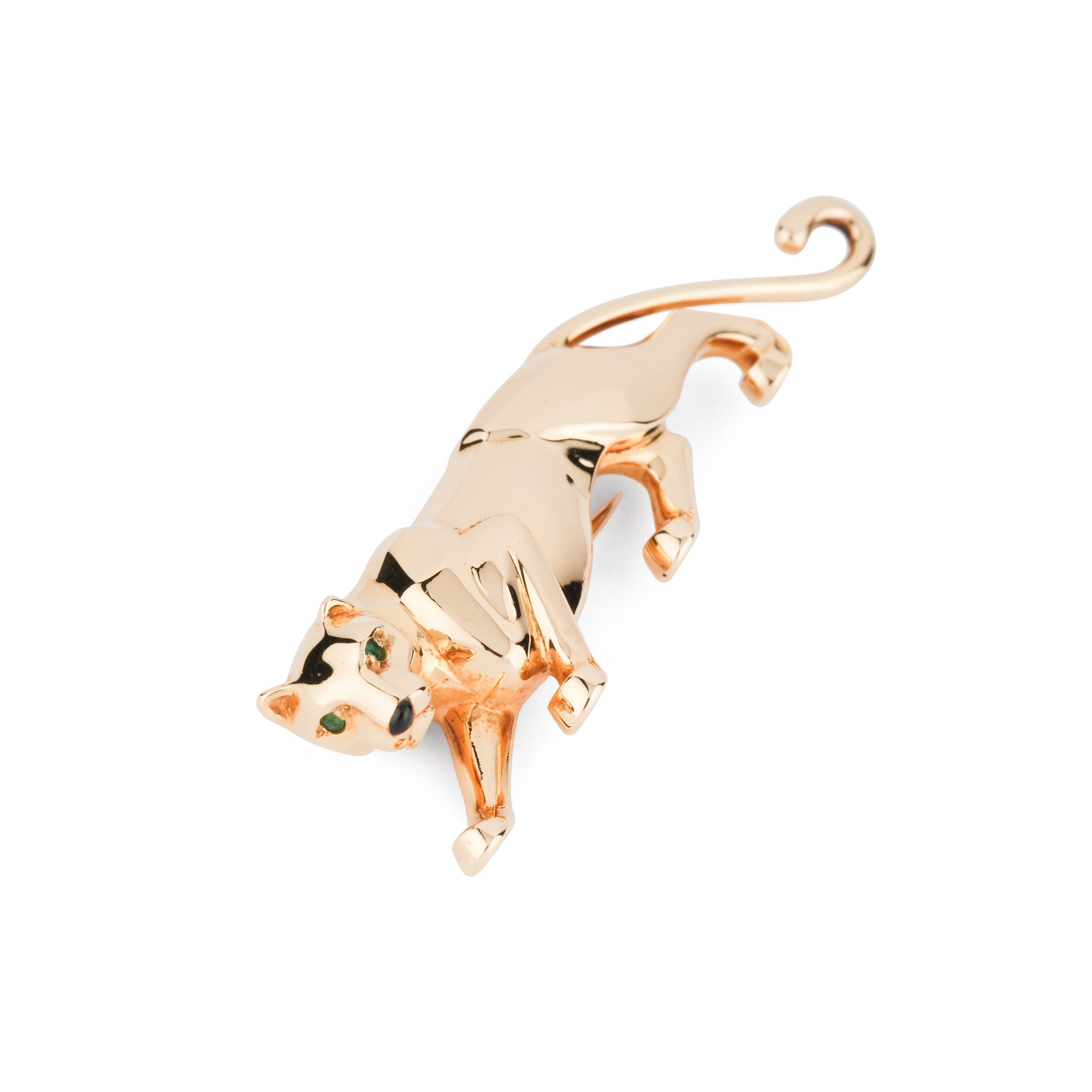 Une broche Cartier "Panthère" en or jaune, onyx et émeraude.
