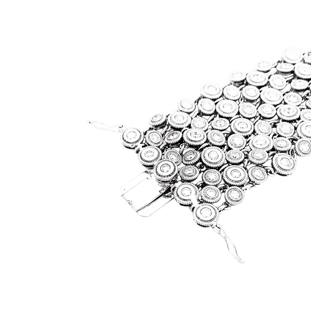 Bracelet souple, or blanc et diamants.