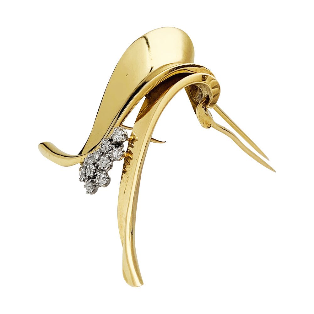 Broche Fontana en or jaune 750/000 et platine 950/000 sertie de 10 diamants taille ancienne. Poids brut : 11,4 grammes. - Maison Eloe