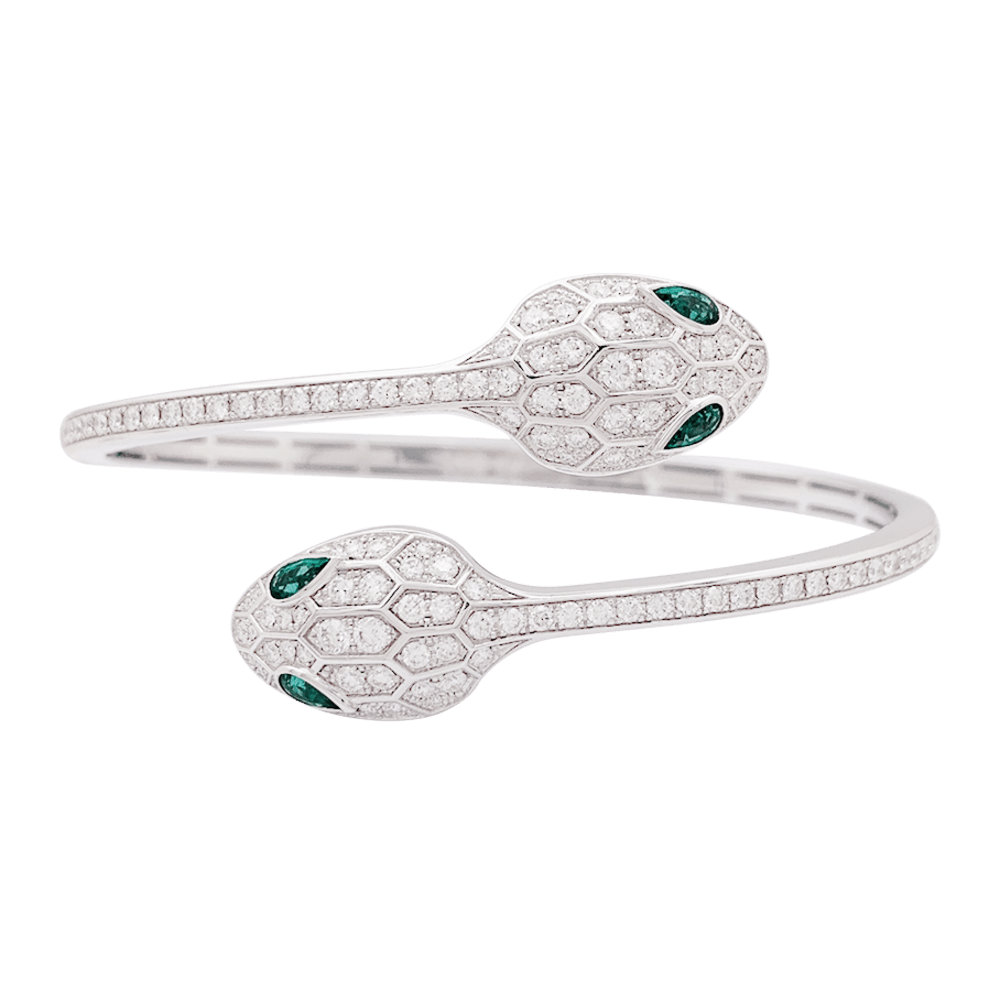 Bracelet Bulgari "Serpenti Seduttori" or blanc, diamants, émeraudes. - Maison Eloe