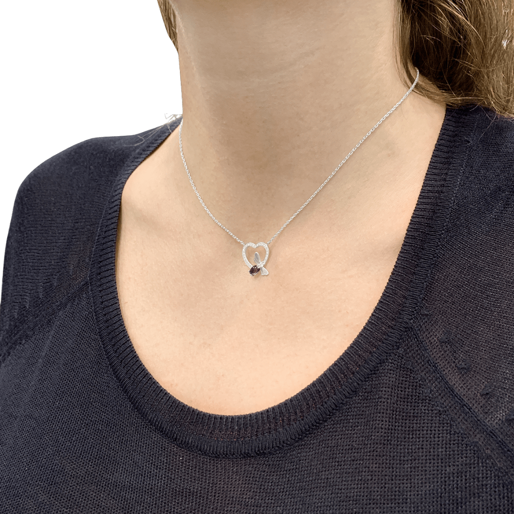 Collier Chaumet, « Attrape-moi si tu m’aimes », or blanc, améthyste, diamants.