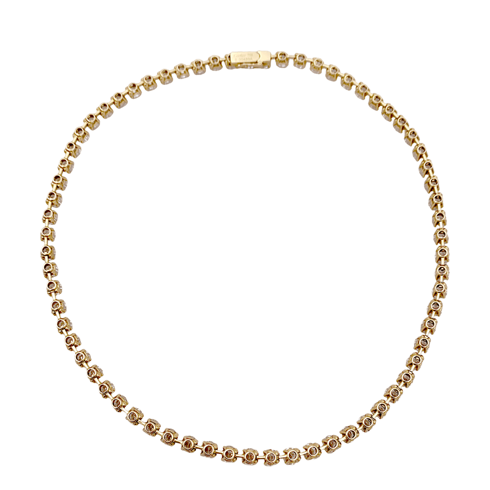 Collier rivière Cartier, or jaune et diamants.