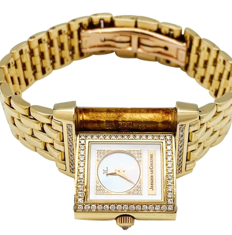 Montre Jaeger Lecoultre "Reverso Duetto" en or jaune, nacre et diamants.