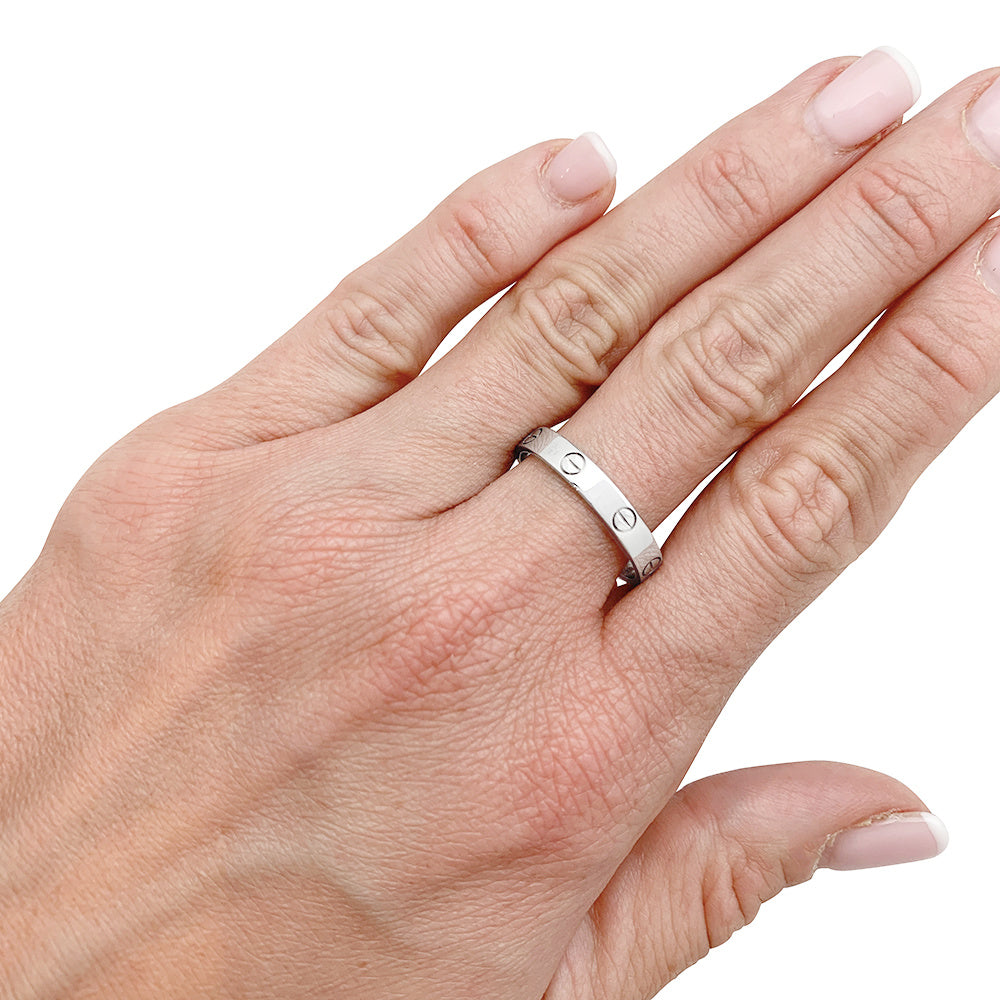 Bague Cartier, "Alliance Love", or blanc.