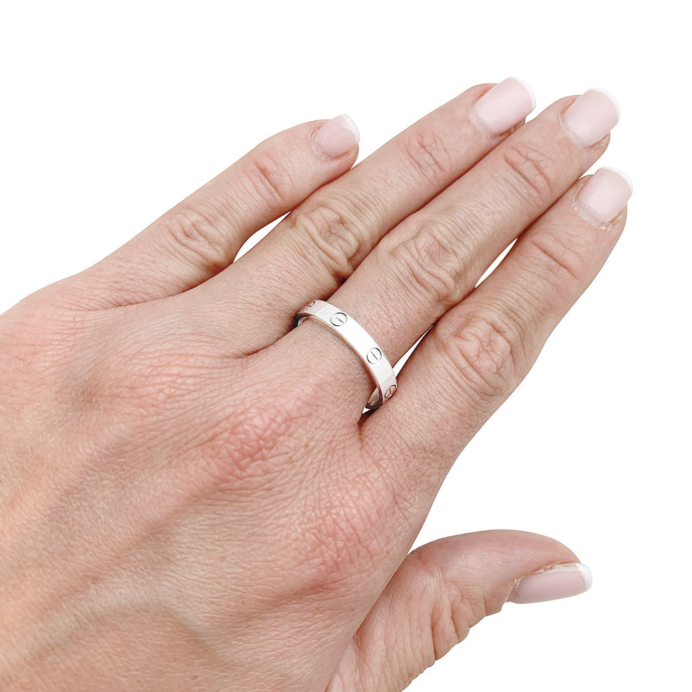 Bague Cartier, "Alliance Love", or blanc.