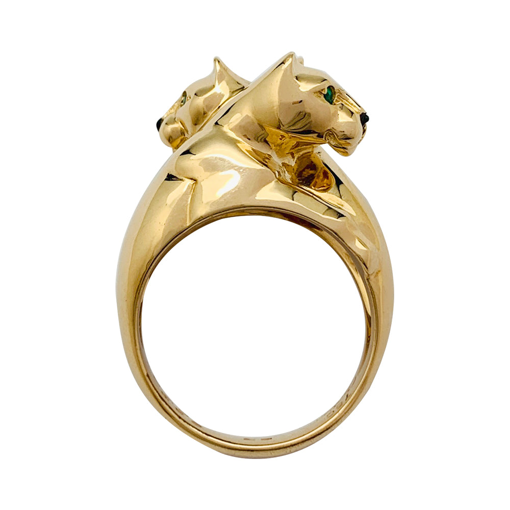 Bague Cartier, "Kozra", en or jaune, émeraude, onyx.