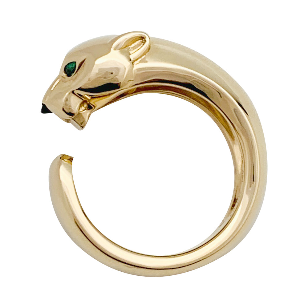 Bague Cartier "Panthère" en or jaune, grenats et onyx.