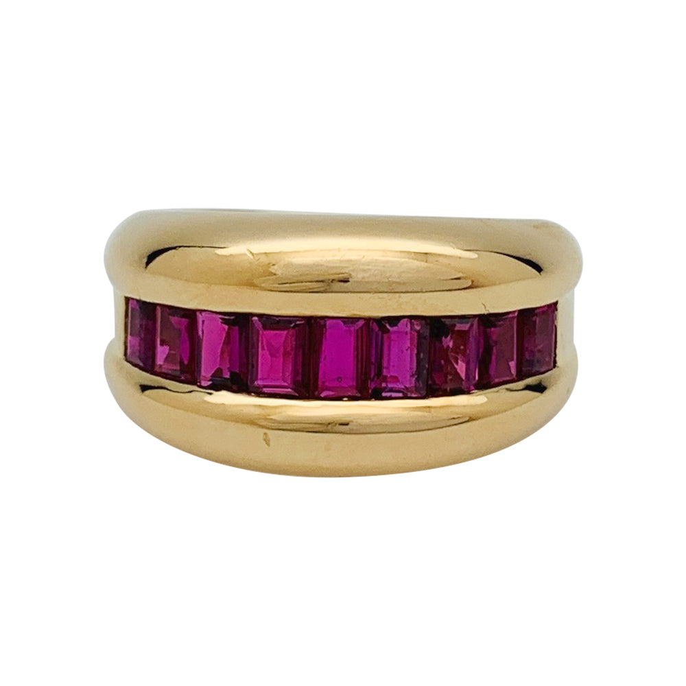 Bague Cartier,"Odin", or jaune, rubis calibrés.