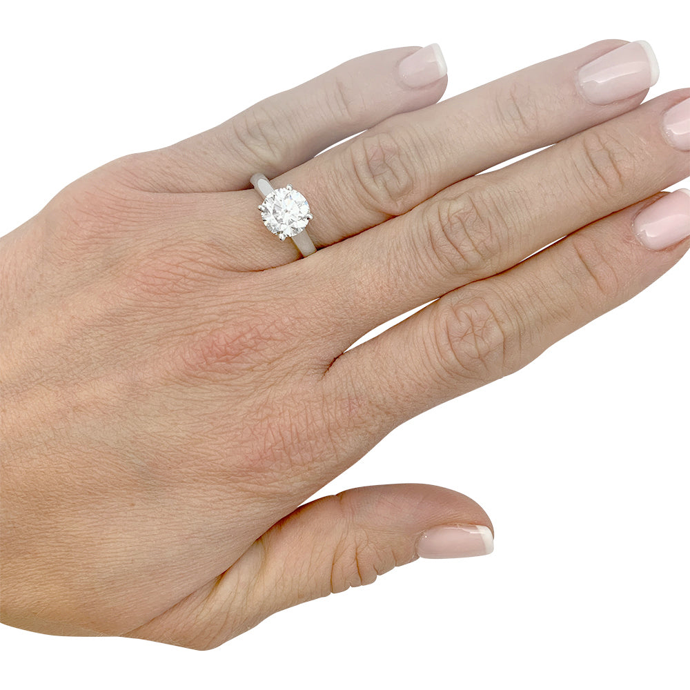 Cartier solitaire, "1895", platinum.