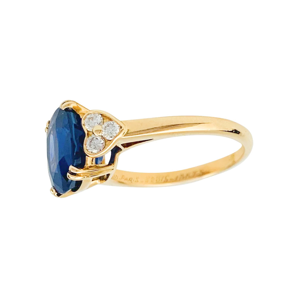 Mauboussin ring, centered with an oval sapphire framed by diamonds.