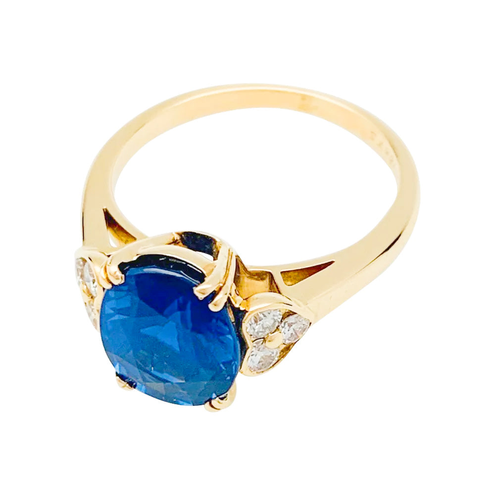 Mauboussin ring, centered with an oval sapphire framed by diamonds.