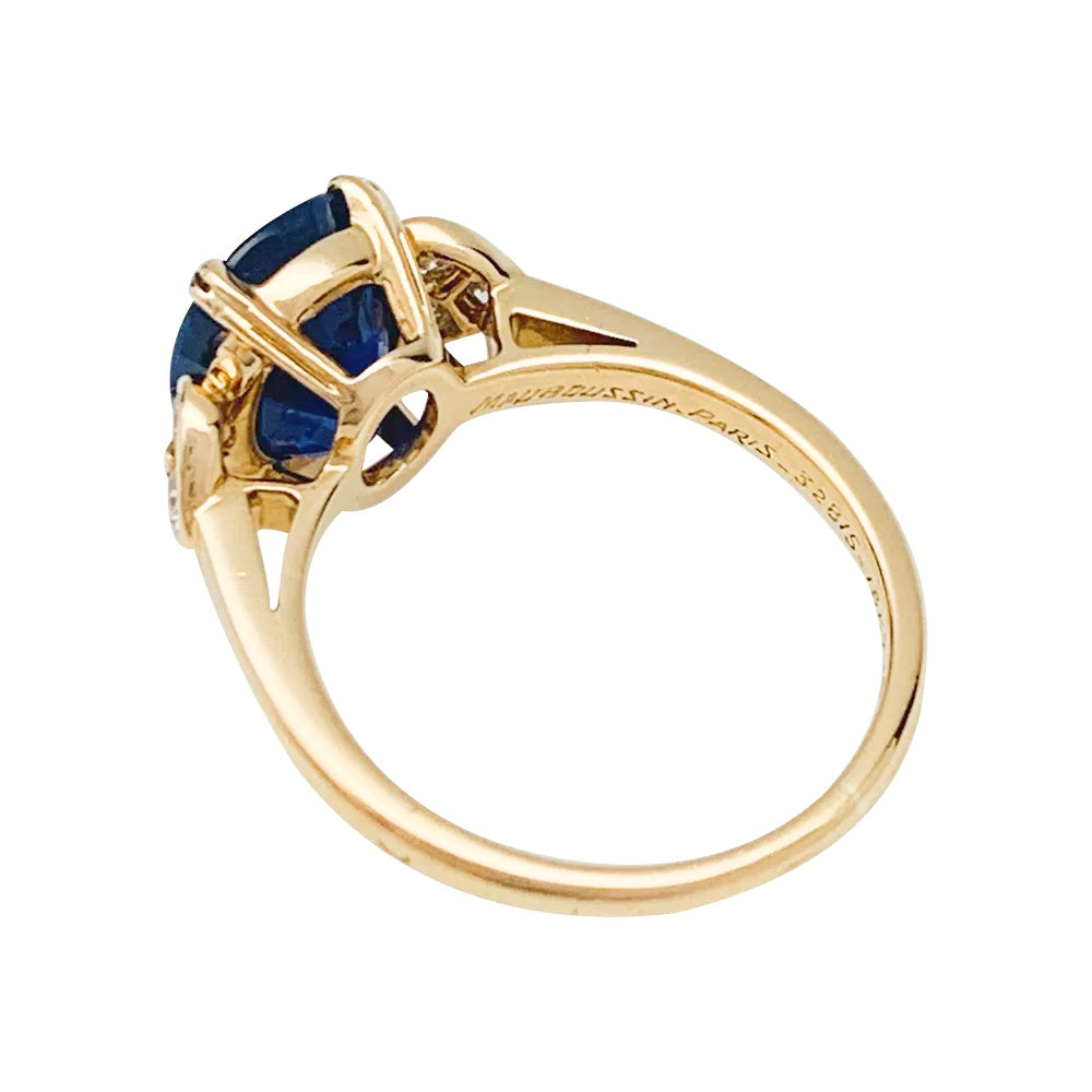 Mauboussin ring, centered with an oval sapphire framed by diamonds.