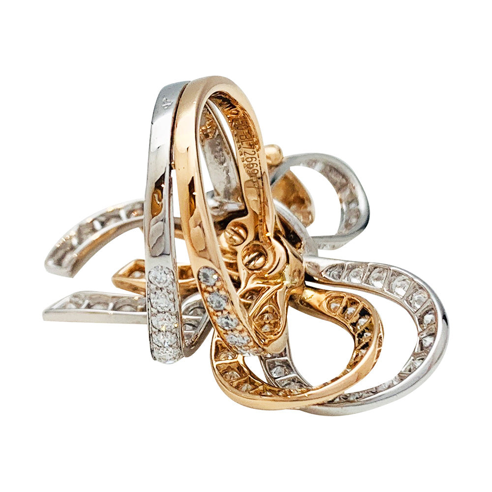 Van Cleef & Arpels ring, "Double Knot", white gold, pink gold, diamonds.