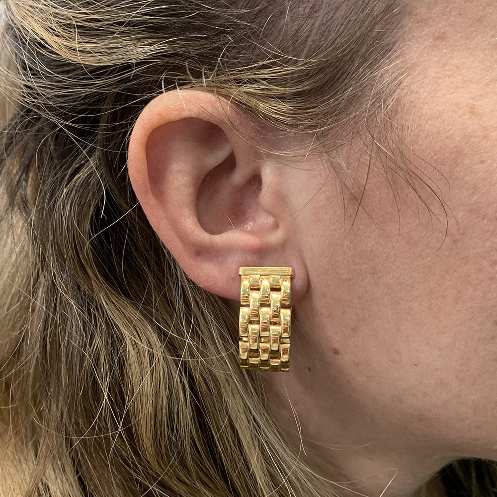 Cartier Panther link earrings in yellow gold.