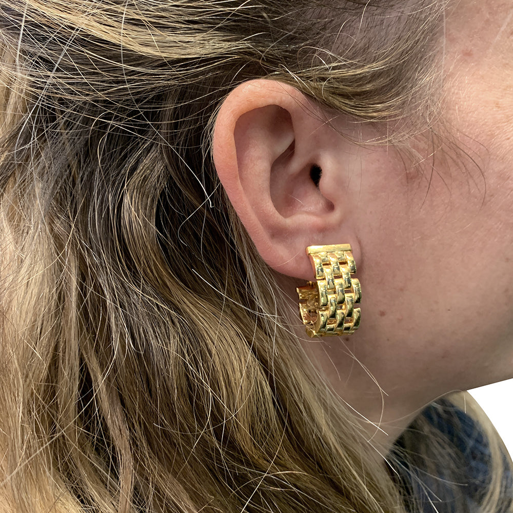 Cartier Panther link earrings in yellow gold.